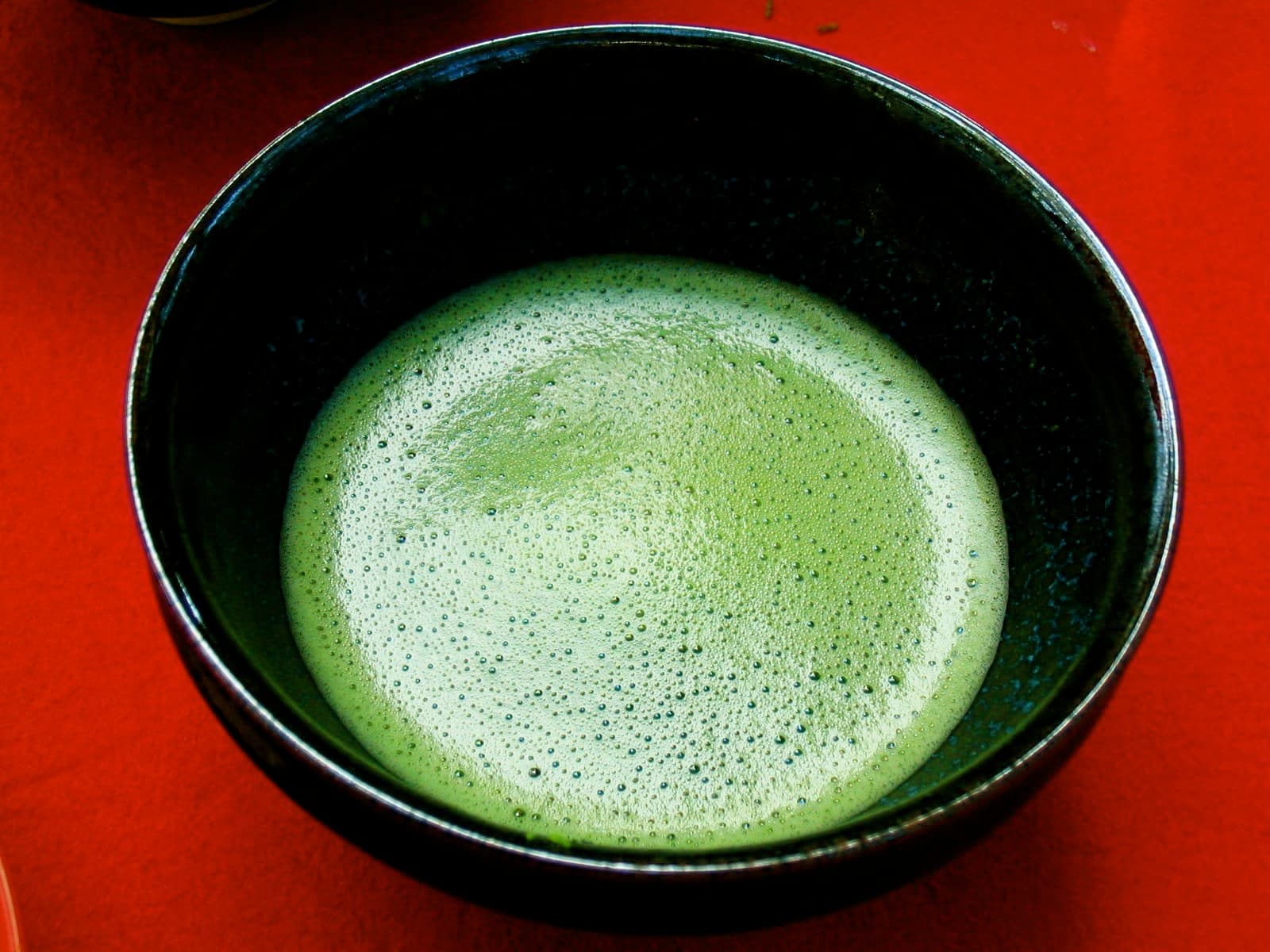 Matcha preparation — whisking premium matcha